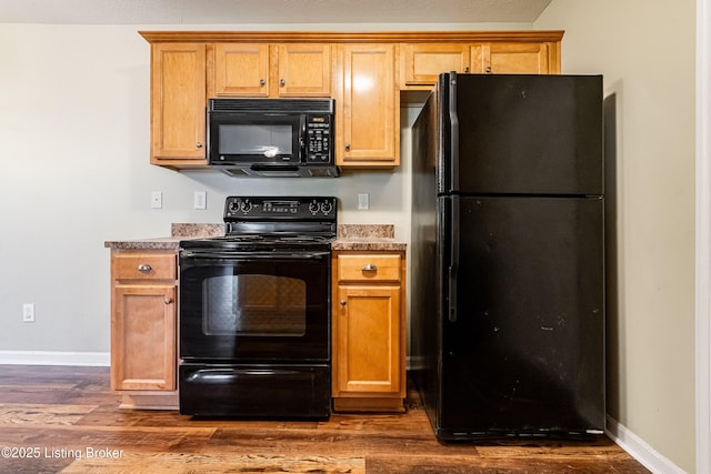 10202 Deer Vista Dr Unit 202, Louisville, KY 40291 - kitchen featuring black appliances, dark wood-type flooring, baseboards, and light countertops