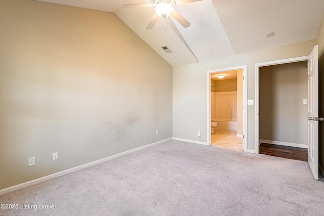 10202 Deer Vista Dr Unit 202, Louisville, KY 40291 - unfurnished bedroom with carpet floors, vaulted ceiling, baseboards, ensuite bath, and a ceiling fan