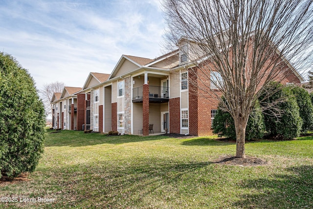 10202 Deer Vista Dr Unit 202, Louisville, KY 40291 - view of property exterior with a lawn and brick siding