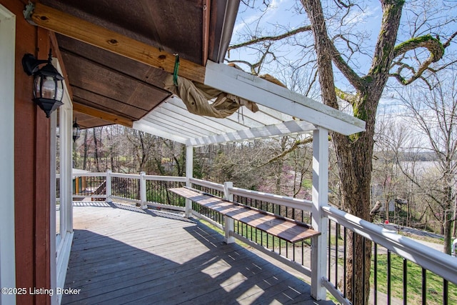 wooden deck featuring a pergola