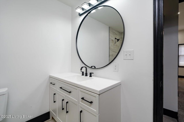 2209 Shelby St, New Albany, IN 47150 - bathroom featuring baseboards, toilet, and vanity