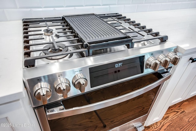 interior details with stainless steel range with gas stovetop