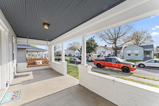view of patio with a porch and a residential view
