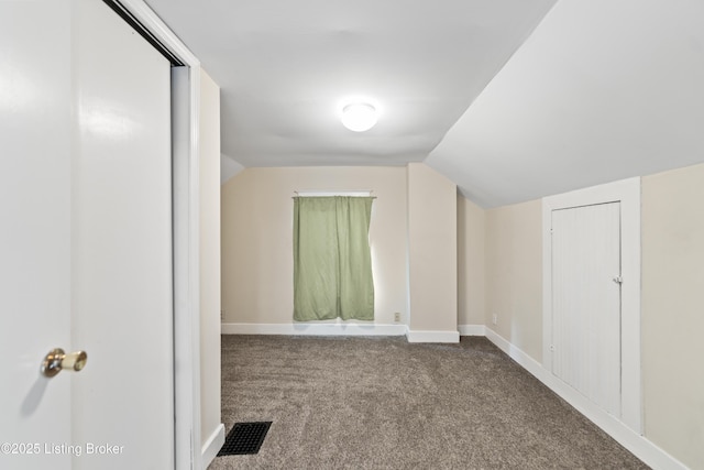 bonus room featuring vaulted ceiling, carpet flooring, visible vents, and baseboards
