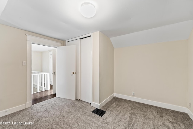 additional living space with carpet floors and baseboards