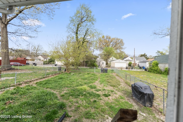 view of yard with fence and a residential view