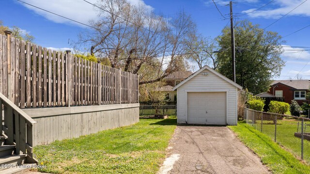 109 Ridgeway Ave, Louisville, KY 40207 - view of yard with a detached garage, driveway, and an outdoor structure