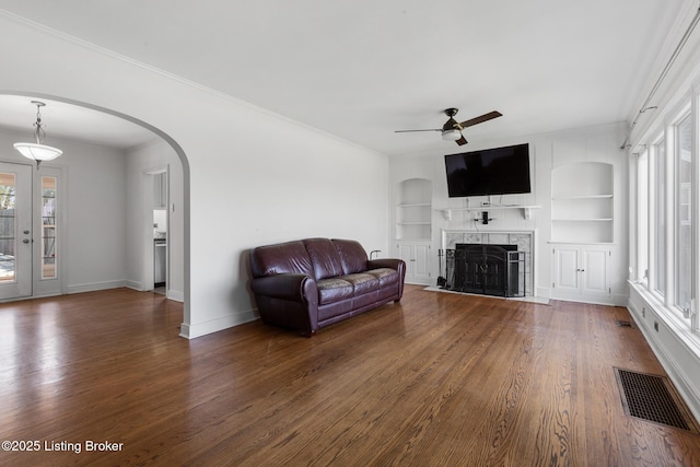 109 Ridgeway Ave, Louisville, KY 40207 - living area with crown molding, dark wood-style flooring, baseboards, built in features, and ceiling fan