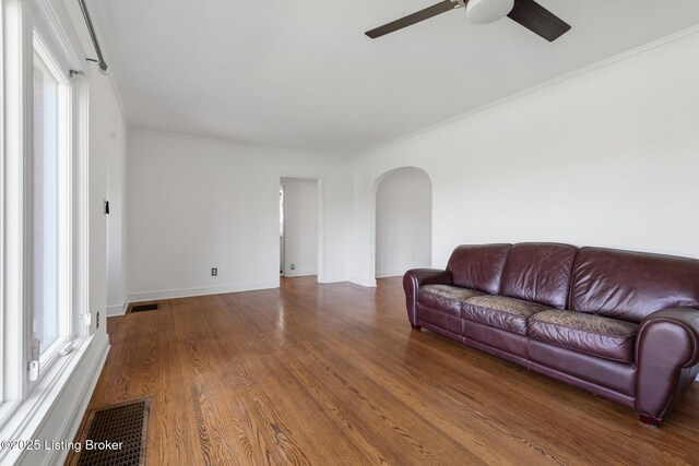 109 Ridgeway Ave, Louisville, KY 40207 - living area with arched walkways, ceiling fan, healthy amount of natural light, wood finished floors, and ornamental molding