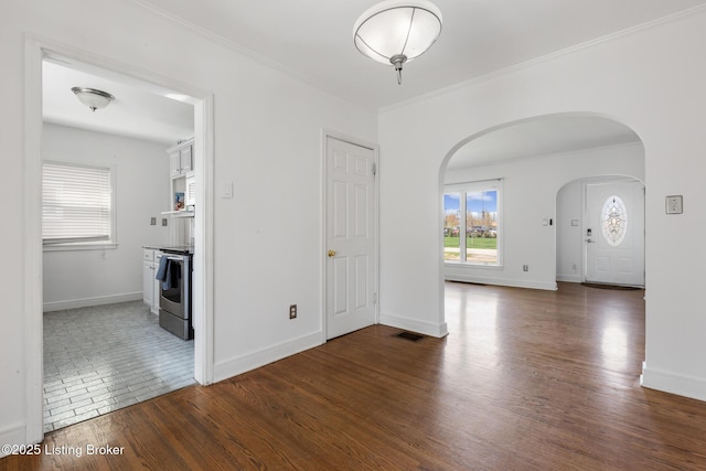 109 Ridgeway Ave, Louisville, KY 40207 - empty room featuring arched walkways, ornamental molding, baseboards, and wood finished floors