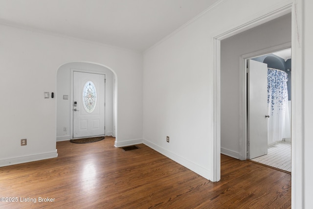 109 Ridgeway Ave, Louisville, KY 40207 - entryway featuring arched walkways, ornamental molding, wood finished floors, and baseboards