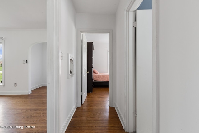 109 Ridgeway Ave, Louisville, KY 40207 - corridor featuring dark wood-style flooring, arched walkways, and baseboards