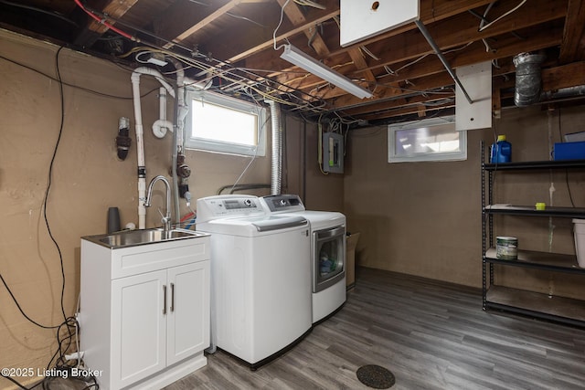 109 Ridgeway Ave, Louisville, KY 40207 - laundry room featuring washer and clothes dryer, electric panel, and wood finished floors