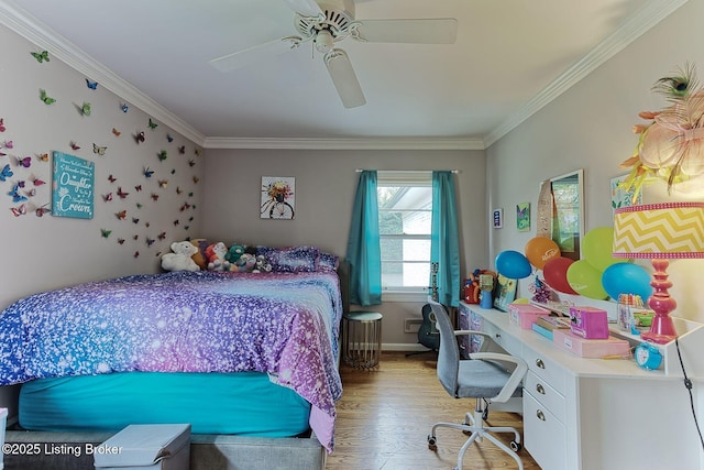 bedroom with a ceiling fan, wood finished floors, and ornamental molding