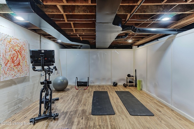workout area featuring wood finished floors