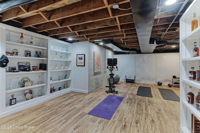 workout room with wood finished floors