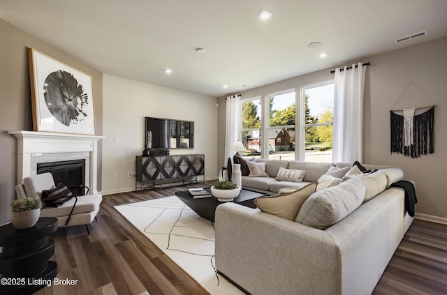 LOT209 Cobblestone Ln, La Grange, KY 40031 - living area featuring recessed lighting, dark wood-type flooring, baseboards, and a glass covered fireplace