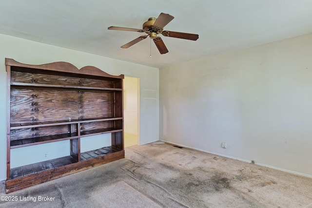 4311 Kurtz Ave, Louisville, KY 40229 - unfurnished bedroom with baseboards, a ceiling fan, and carpet flooring