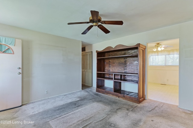 4311 Kurtz Ave, Louisville, KY 40229 - unfurnished living room featuring carpet floors, visible vents, baseboards, and ceiling fan