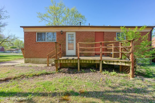 4311 Kurtz Ave, Louisville, KY 40229 - rear view of house with brick siding and a wooden deck