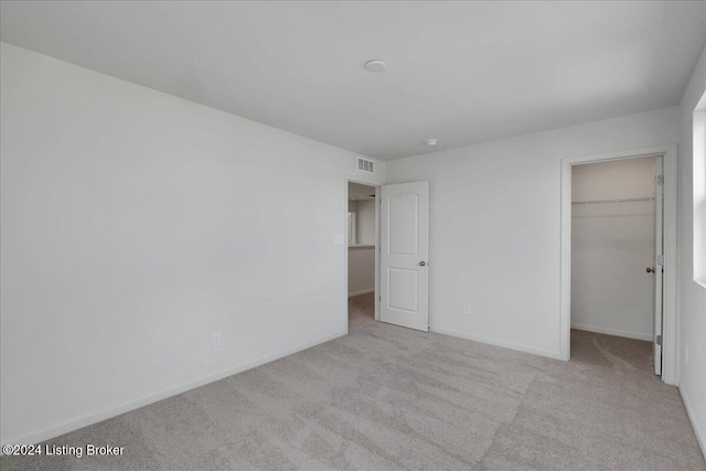 1848 Washington Blvd, Lyndon, KY 40242 - unfurnished bedroom featuring carpet floors, a spacious closet, baseboards, and a closet