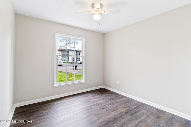 unfurnished room featuring ceiling fan, wood finished floors, and a wealth of natural light