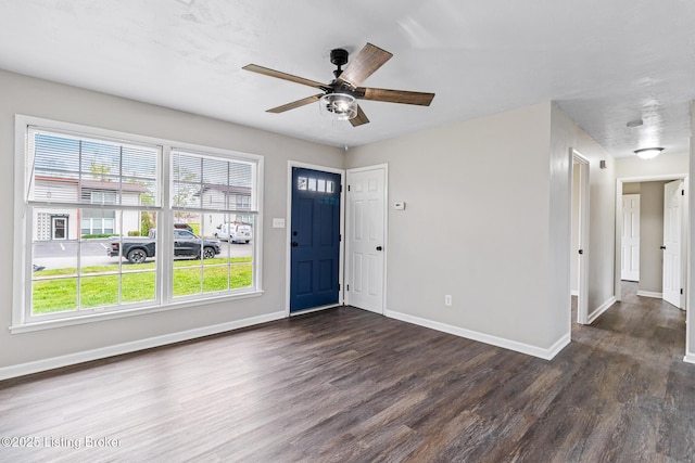 entrance foyer featuring baseboards, a ceiling fan, and wood finished floors
