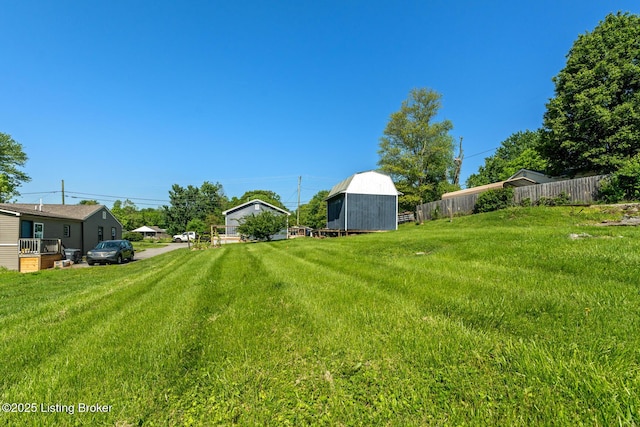 view of yard with a barn and an outdoor structure
