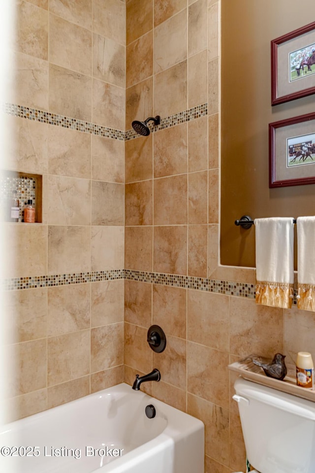 full bathroom featuring tile walls, toilet, and bathing tub / shower combination