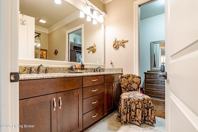 full bathroom featuring tile patterned flooring, double vanity, and crown molding