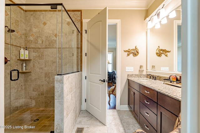 full bath with tile patterned floors, a stall shower, visible vents, crown molding, and vanity