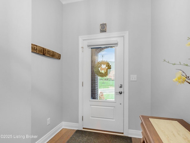 entryway featuring wood finished floors and baseboards