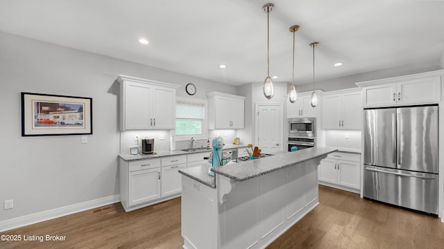 kitchen featuring white cabinetry, stainless steel appliances, and dark wood-type flooring