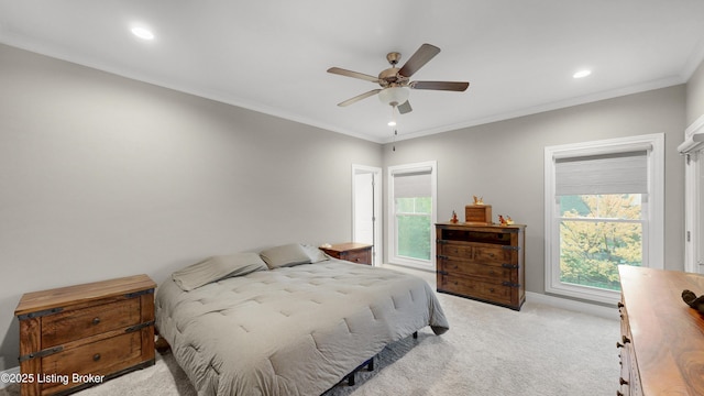 carpeted bedroom featuring recessed lighting, ornamental molding, and multiple windows