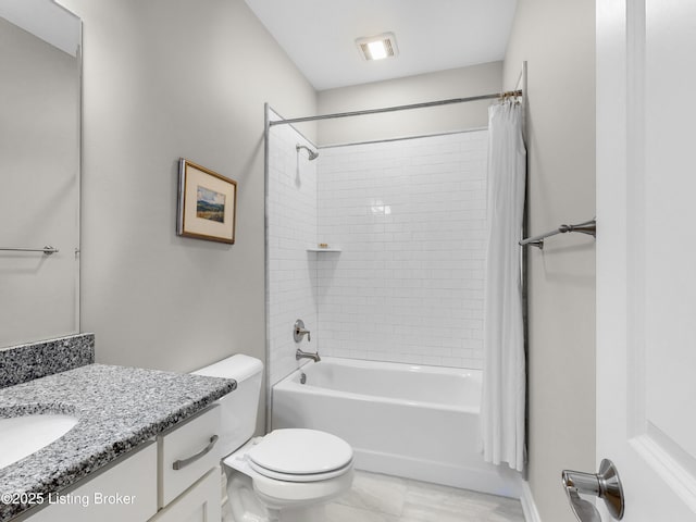 bathroom with shower / bathtub combination with curtain, vanity, and toilet