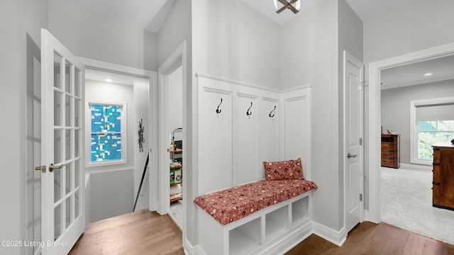 mudroom featuring baseboards and wood finished floors