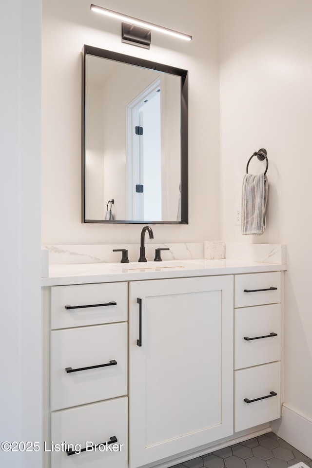 bathroom with vanity and tile patterned flooring