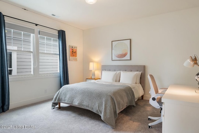 carpeted bedroom with baseboards and visible vents