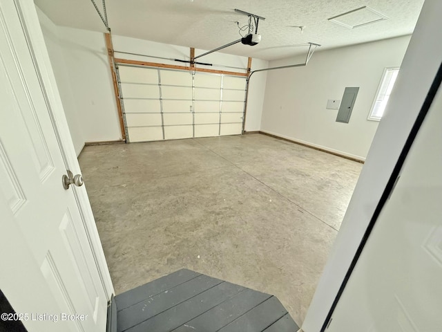 garage featuring a garage door opener and electric panel