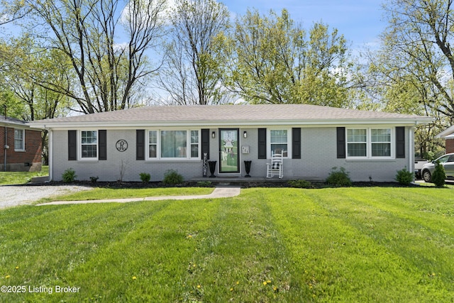 single story home with brick siding and a front lawn