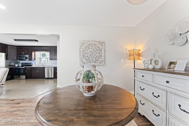 dining space with light wood-style floors