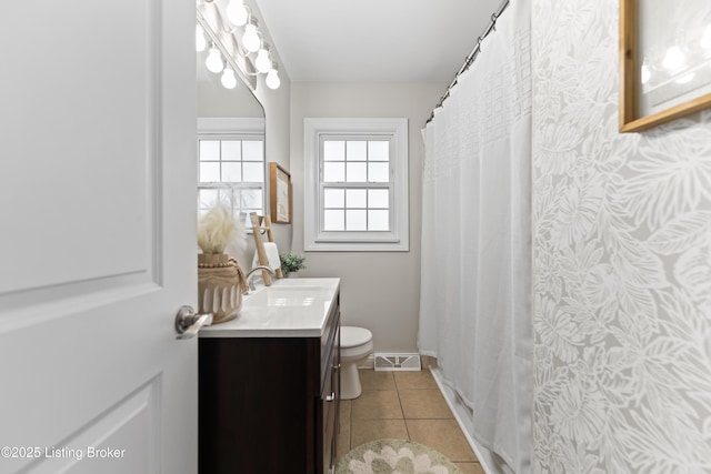 full bath with tile patterned floors, a shower with curtain, toilet, visible vents, and vanity