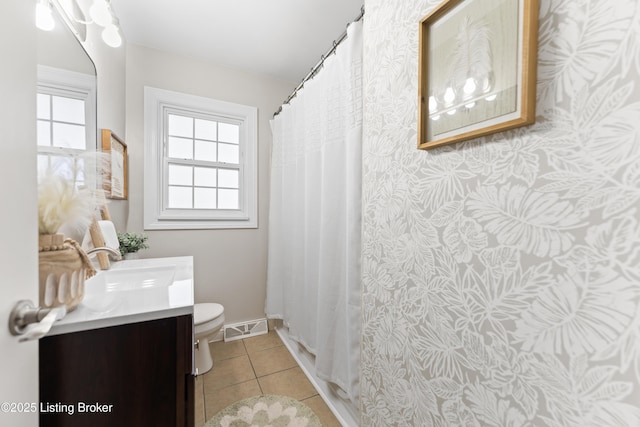 full bathroom featuring tile patterned flooring, visible vents, toilet, and a healthy amount of sunlight