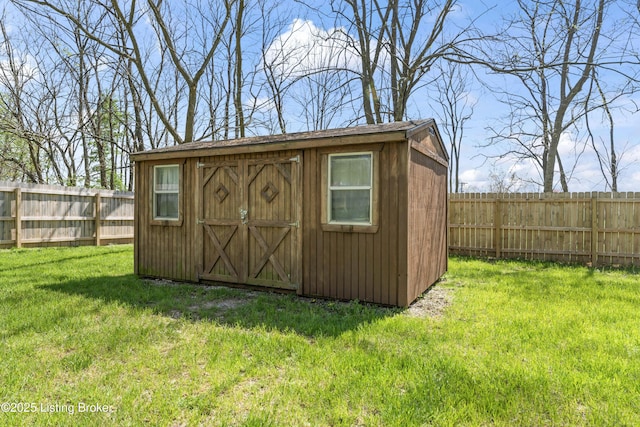 view of shed with a fenced backyard