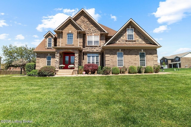 craftsman-style home with a front lawn and brick siding