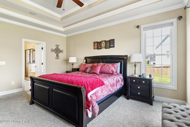 bedroom with ornamental molding, a raised ceiling, and light carpet