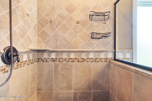 bathroom with a tile shower