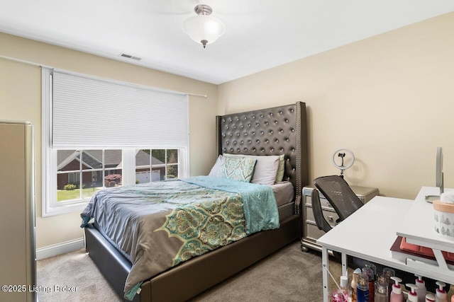 bedroom with carpet floors and visible vents