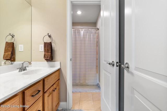 full bathroom featuring tile patterned flooring, curtained shower, and vanity