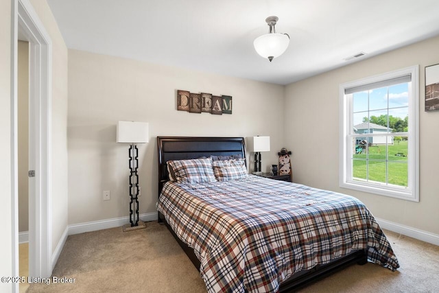 bedroom featuring carpet, visible vents, and baseboards